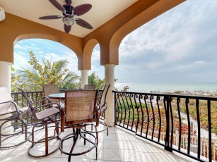 Oceanfront condo features easy beach access, a shared pool, and great views!