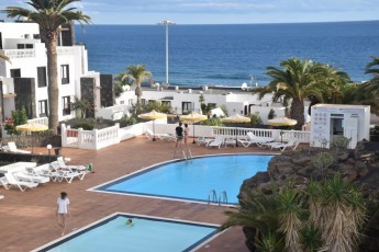 Spacious Downtown Apartment with Pool, Sea View & Balcony – Steps from the Beach & Promenade